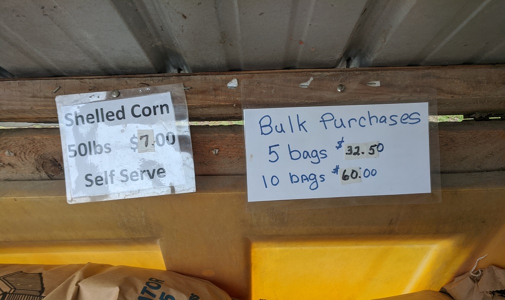 price signs inside of our shelled corn bin